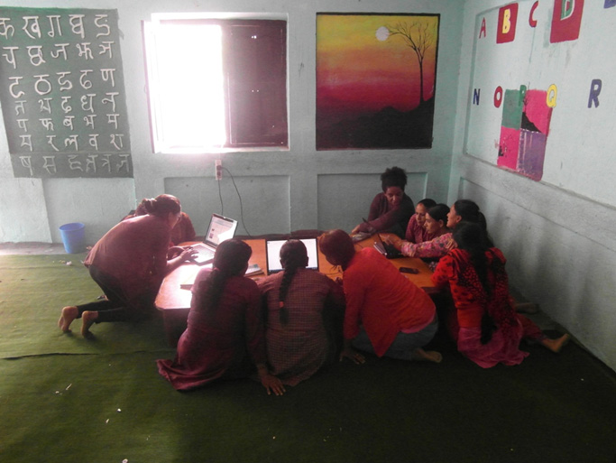 Volunteers giving computer training to women of kavresthali