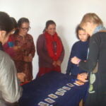Group of early childhood development teachers in Nepal participating in a hands-on classroom activity training session