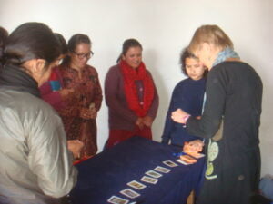 Group of early childhood development teachers in Nepal participating in a hands-on classroom activity training session