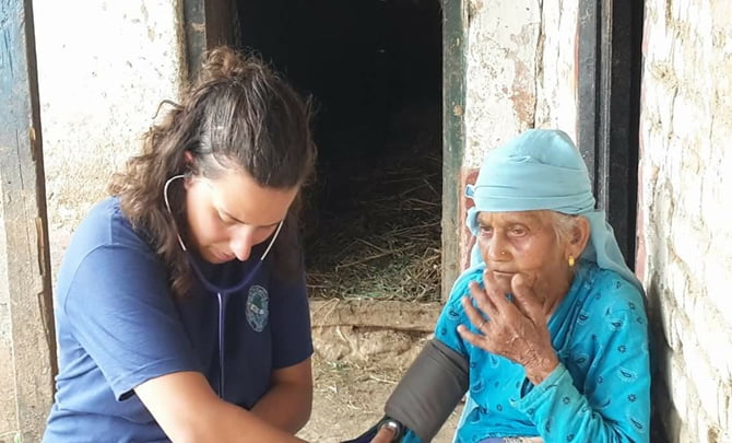 Volunteer of VIN checking health status of Women for diabetes and hypertension