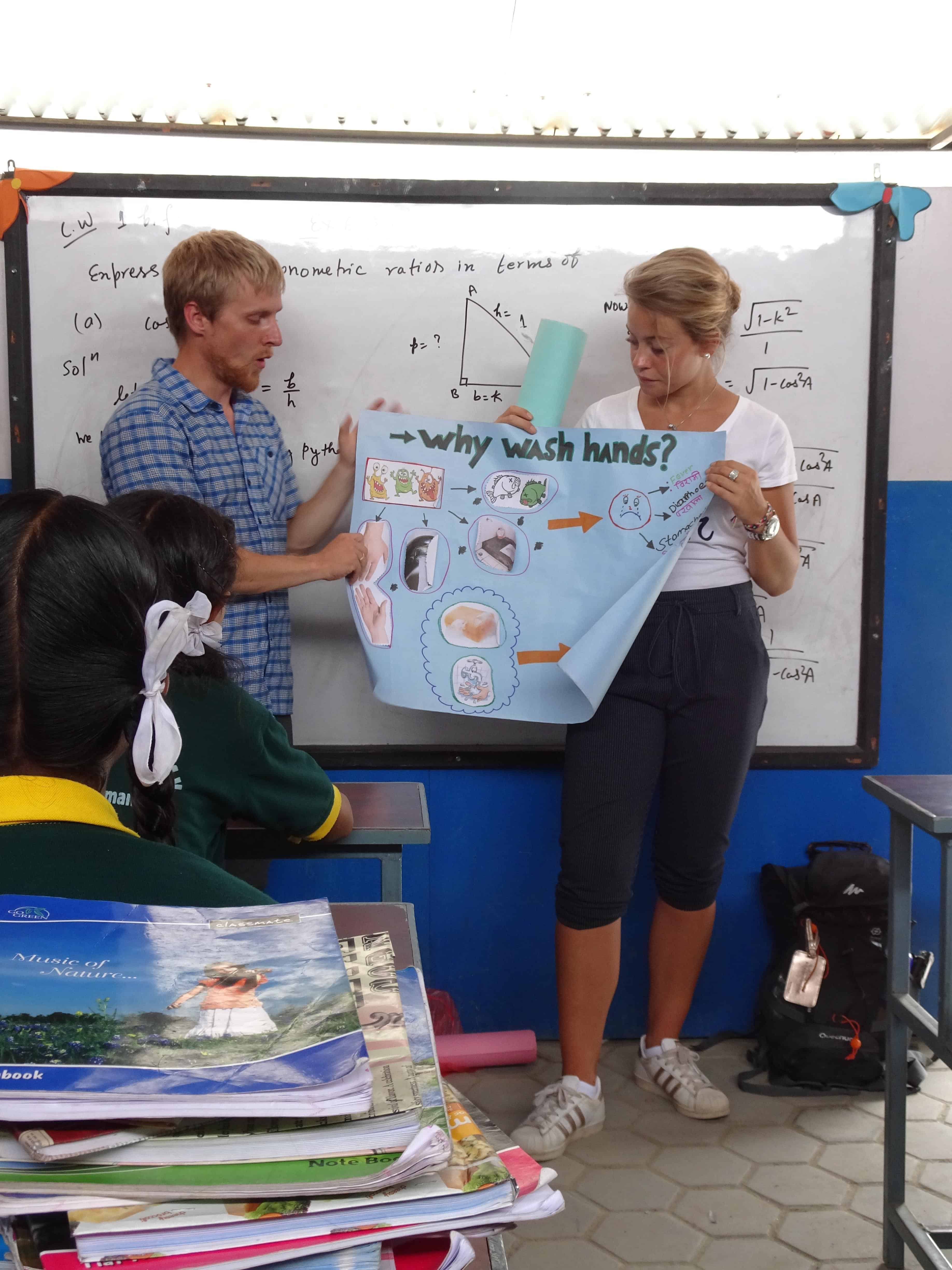 Sherilyn and Melany teaching children about health and hygiene