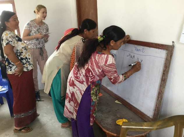 Volunteers teaching essential life skills to women of Kavresthali