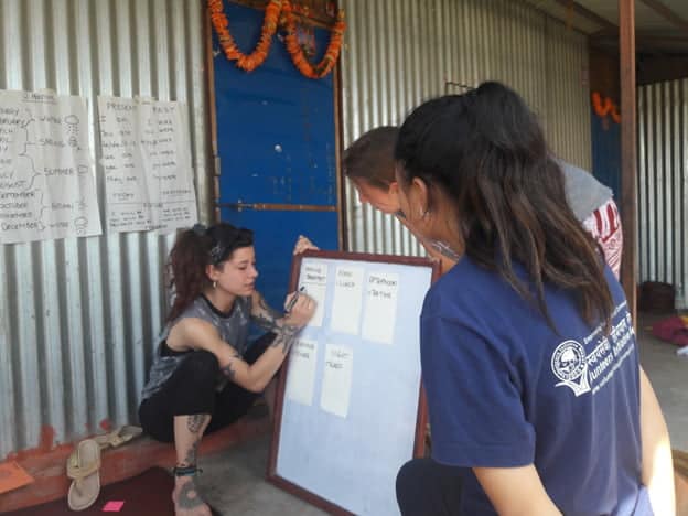 Volunteer writing on the board