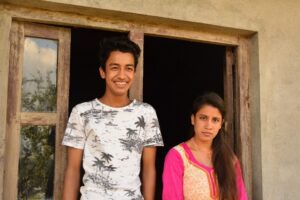 Manita and Sujan in front of their new home in Jitpur
