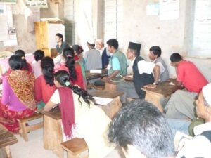 Environmental teaching volunteer conducting a classroom session in Nepal
