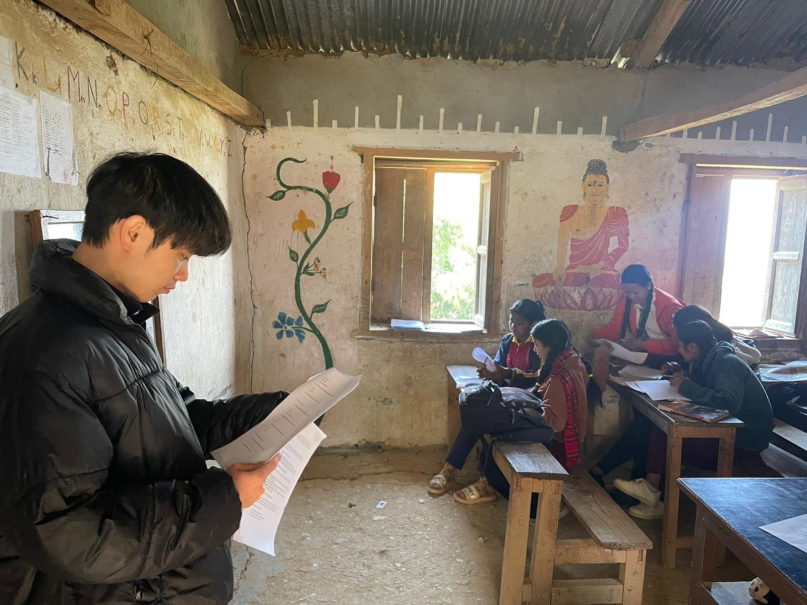 Volunteer writing a grant proposal for a rural education NGO in Nepal.