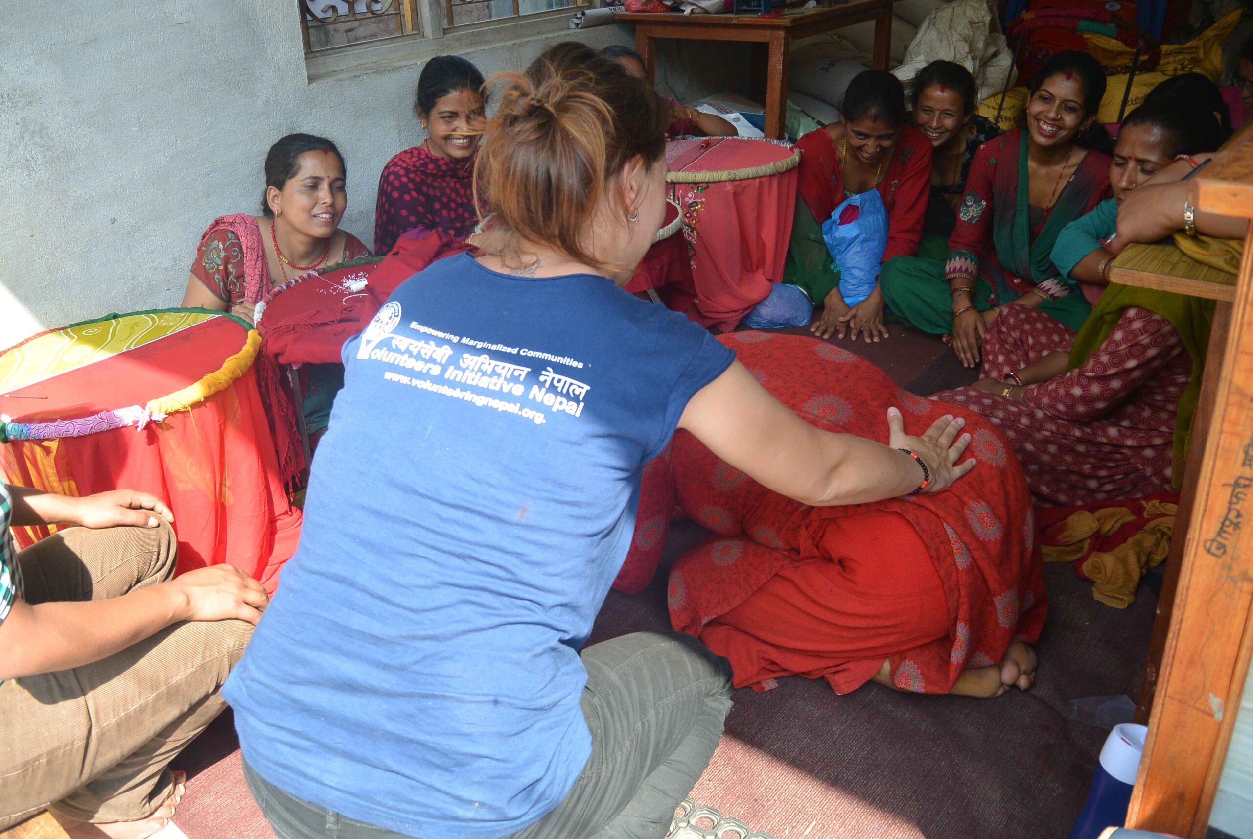 Volunteer physiotherapist assisting patient in Kathmandu clinic.