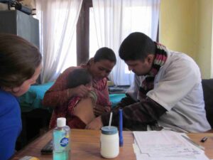 Volunteer conducting women’s health workshop in rural Nepal