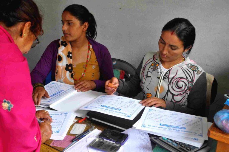 Cooperative-staff-recording-women-profile-for-microfinance