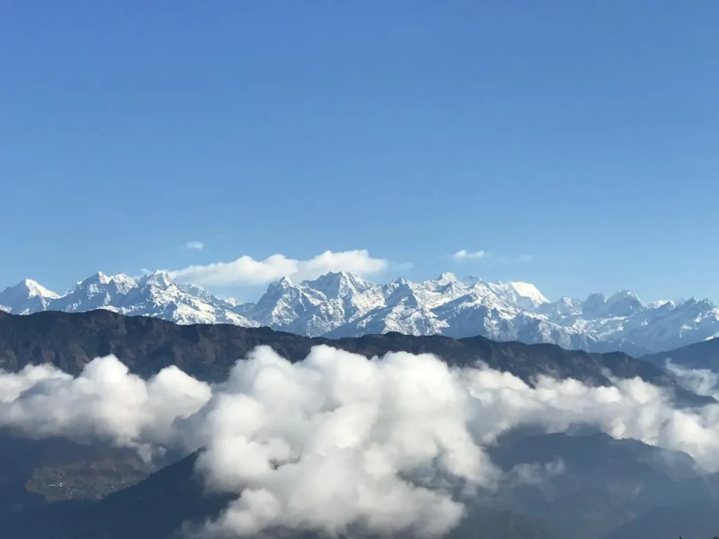 Snow-covered mountains under a blue sky on the Okhaldhunga