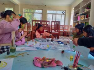 Volunteer teaching children with disabilities in inclusive classroom in Nepal