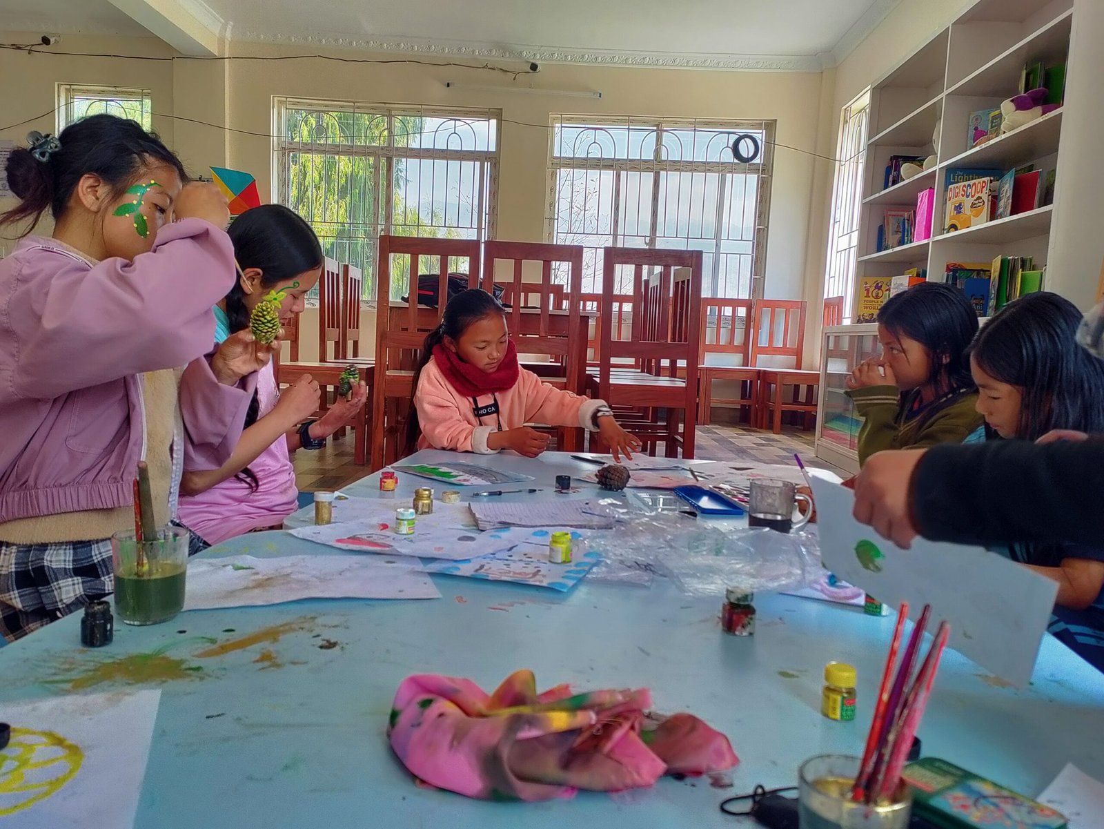 Volunteer teaching children with disabilities in inclusive classroom in Nepal