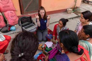 Volunteer mentoring Nepali women in small business workshop